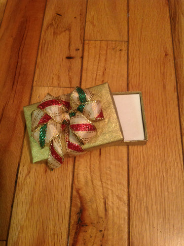 Red  green and gold ribbon on  gold