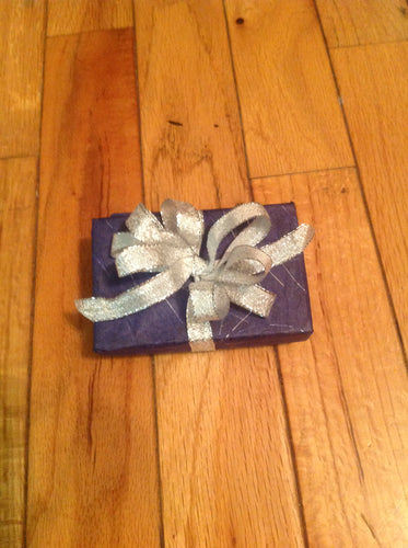 Navy blue with sliver specks and silver bow