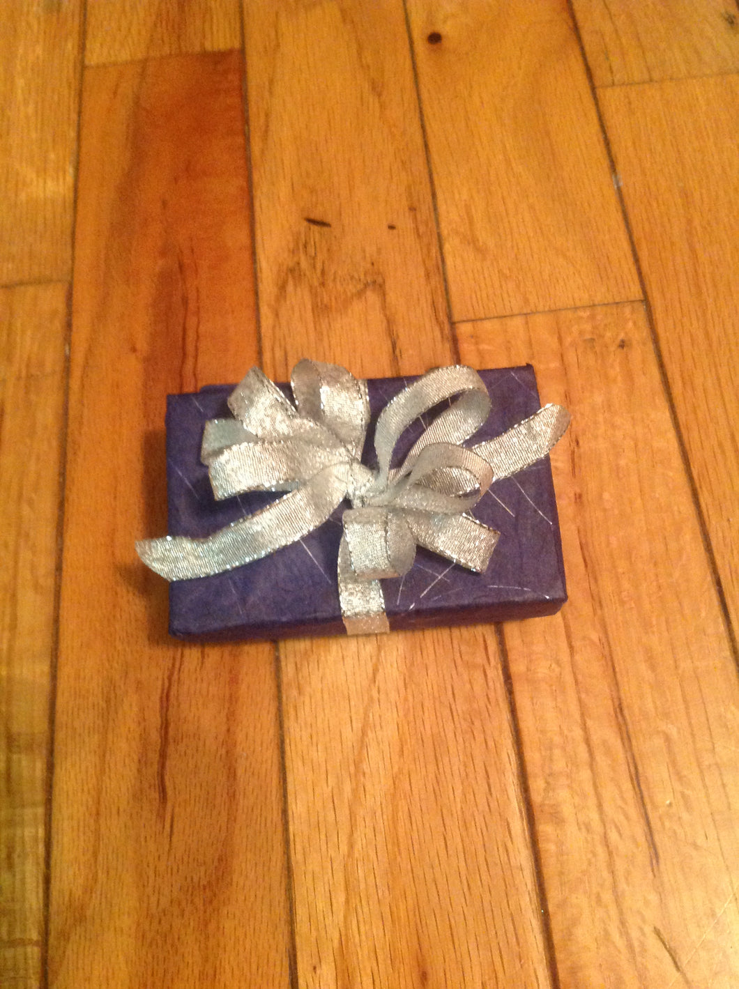 Navy blue with sliver specks and silver bow